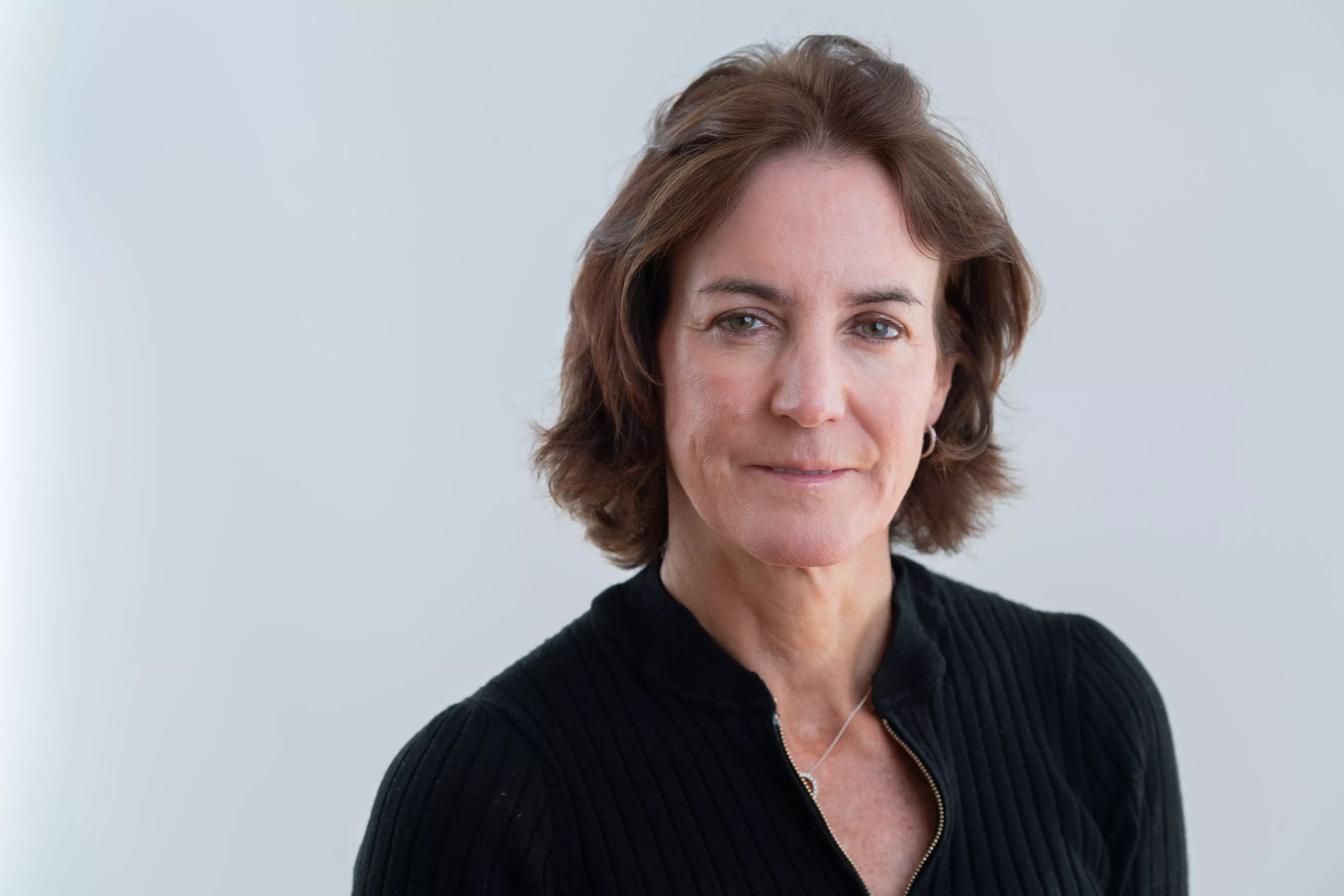 Headshot of a woman in a black shirt